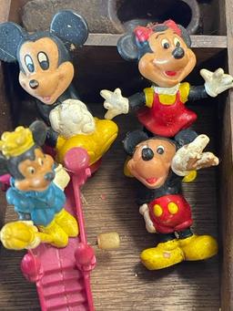 Wood shelf with contents - smurfs and Mickey Mouse, small bottles, marbles