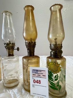 4 small oil lamps