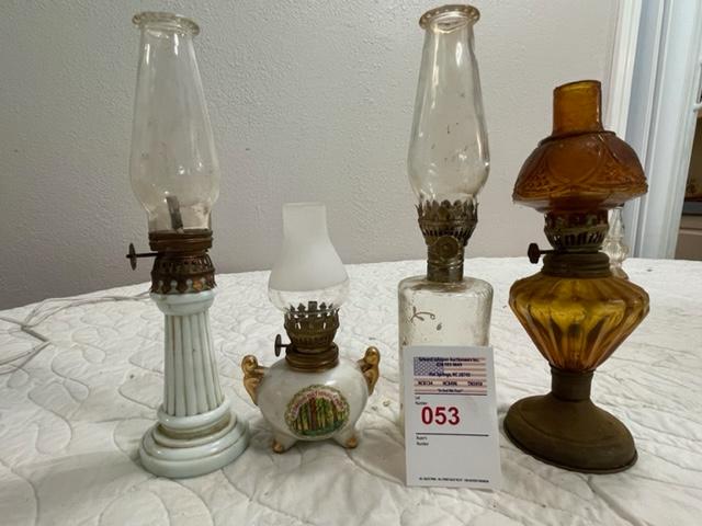 4 small oil lamps