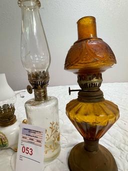 4 small oil lamps