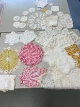 Many antique doilies