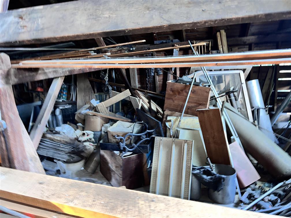 MISC. MATERIALS IN LEFT SIDE BACK CORNER OF BARN ON 2ND FLOOR. COPPER TANK, WIRE, CAST IRON STOVE