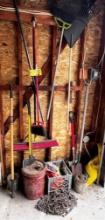 CONTENTS IN CORNER: LONG HANDLED TOOLS, HITCH, AXE, TIRE CHAINS