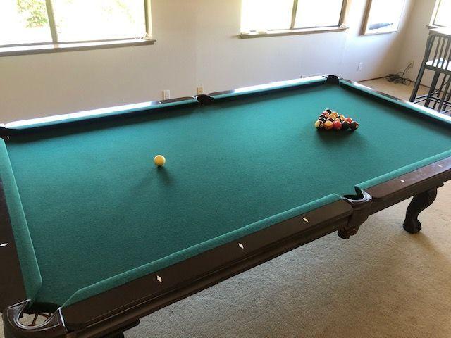 Olhausen pool table with accessories, approximately 6 ft x 9 ft