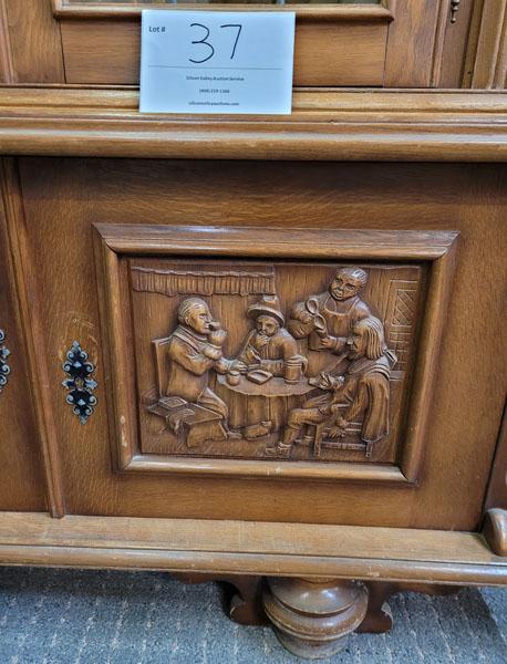 Antique cupboard with glass doors and carved doors