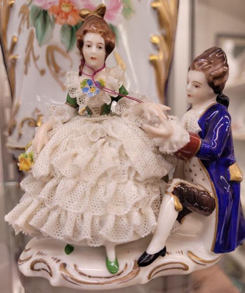 Two porcelain vases, two small plates, eight Dresden figurines