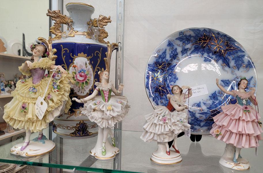 Two porcelain vases, two small plates, eight Dresden figurines