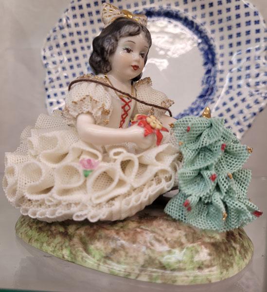 Two porcelain vases, two small plates, eight Dresden figurines