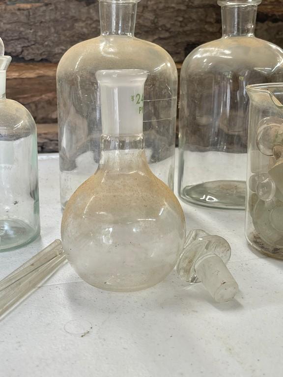 Lot of Beakers and Chemical Bottles