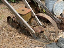 Two Planters made from Push Plows with Wooden Handles