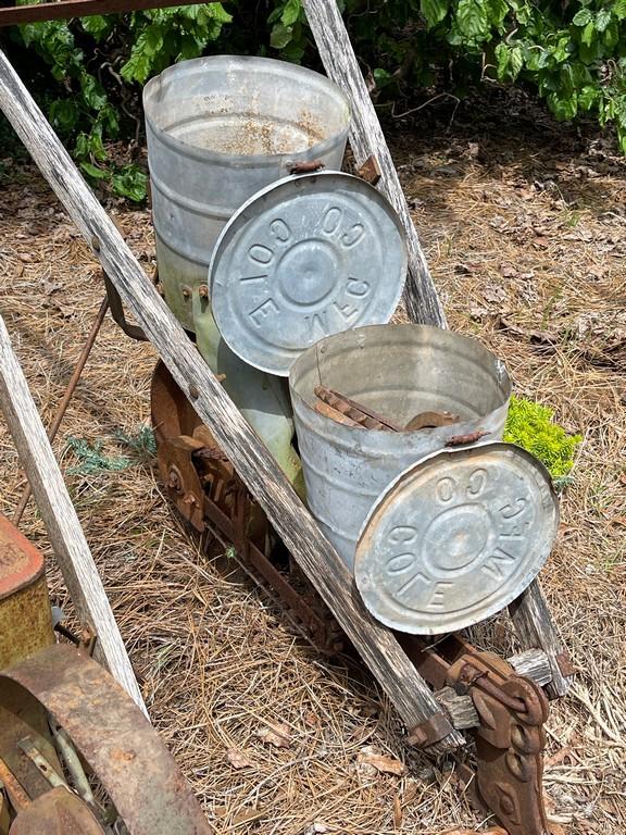 Two Planters made from Push Plows with Wooden Handles