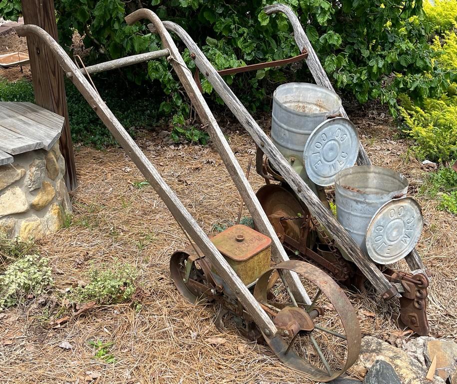 Two Planters made from Push Plows with Wooden Handles