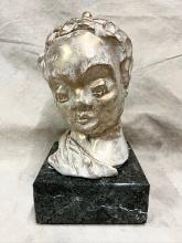 Head of Woman on Marble Base