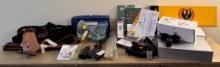 Gun Boxes, Holsters, Cleaning Implements and a Site Lite Laser Sight