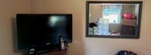 Electronic Lot and Beveled Mirror in Wooden Frame