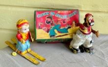 Mechanical Clown on Roller Skate Toy With Box & Tin Boy Skiing