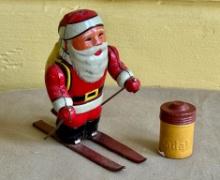 KSK Japan Tin Litho Wind Up Santa on Skis and Kodak Film Canister
