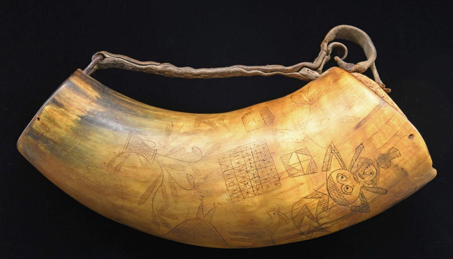 AN INTERESTING FOLK ART CARVED STORAGE HORN OF