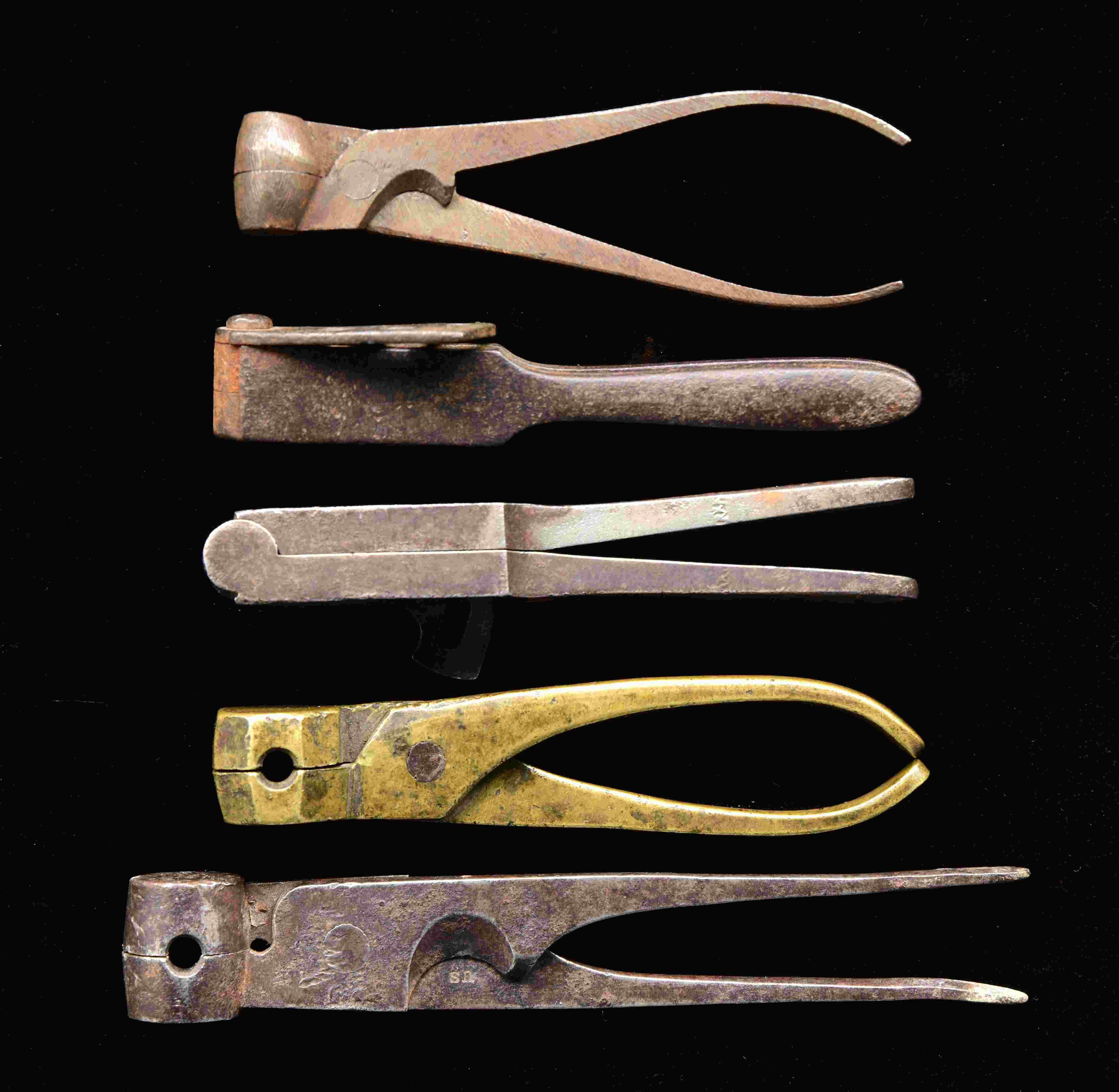 5 EARLY BULLET MOLDS.