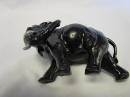 Cast iron elephant figurine with white tusks