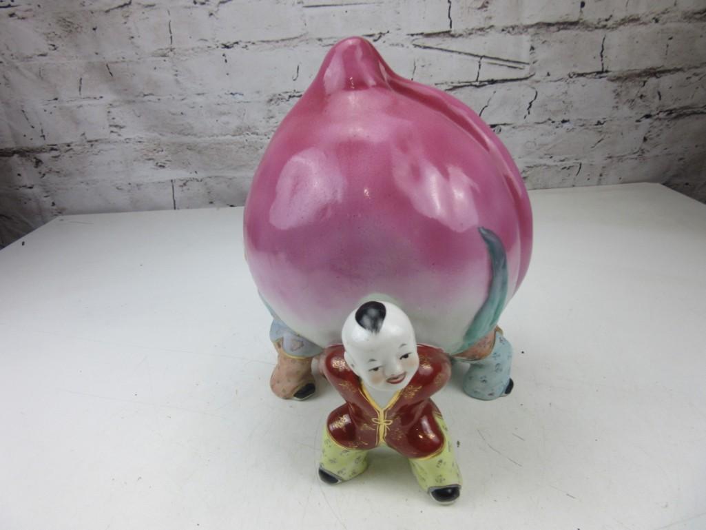 Porcelain Peach Held by Three Chinese Children
