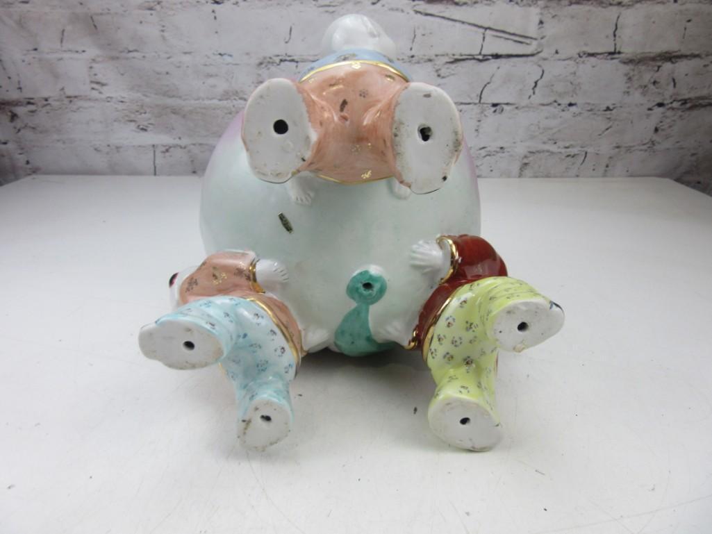 Porcelain Peach Held by Three Chinese Children
