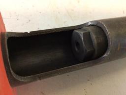 Remington Nail Driver, use 22 shell and a hit on the top with hammer to drive nails into cement