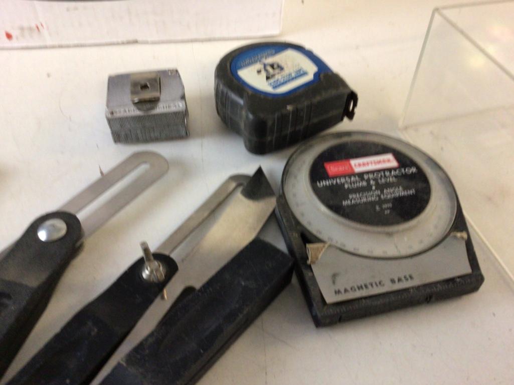 Lot of Measuring tools, includes four angle (one is vintage), two tape measures, two protractors ,