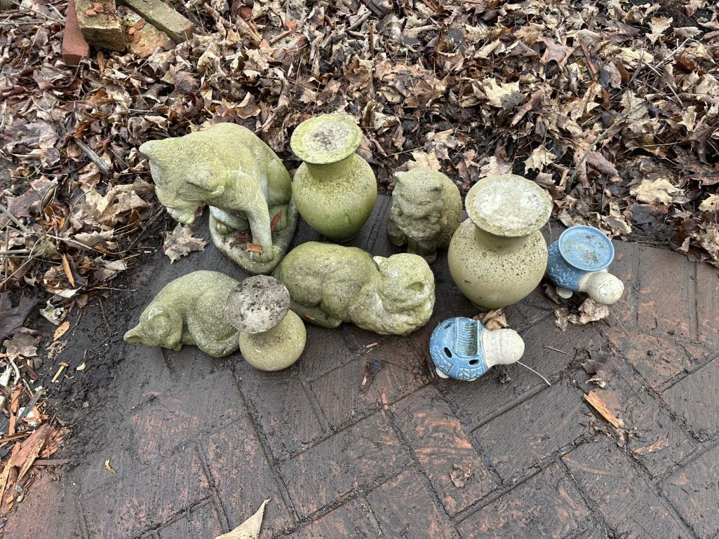 Metal Fence & Concrete Figures On House Side Of Walk