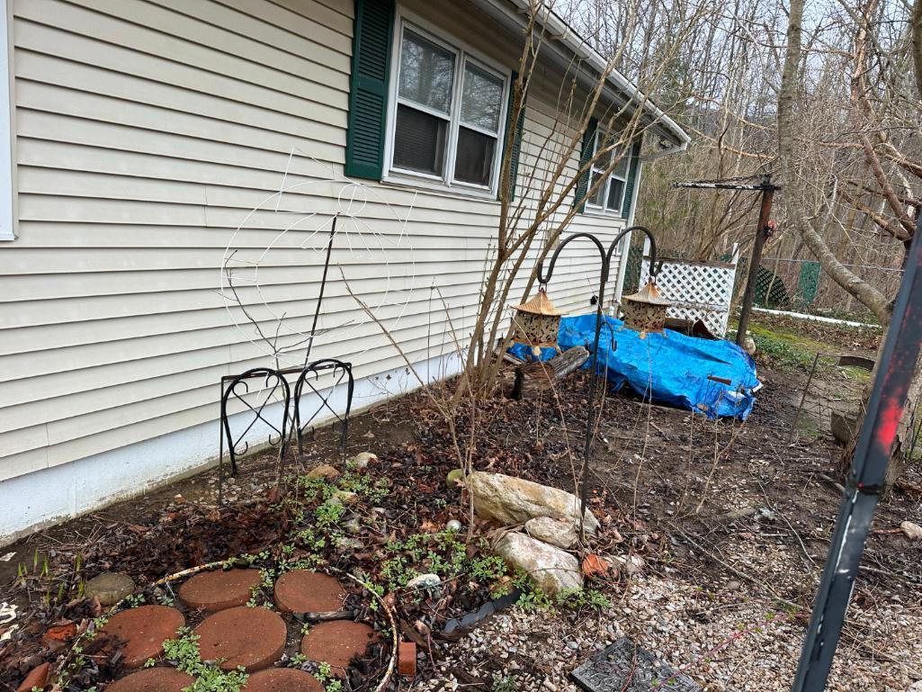 Metal Fence & Concrete Figures On House Side Of Walk