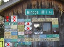 ( 44+/-) Balance of License Plates on Wall