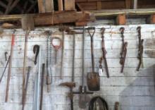Asst. Stick Tools & Chain Binders on Wall