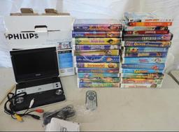 Phillips 8.5" Portable LCD DVD player with remote and 20+ Disney VHS movies.