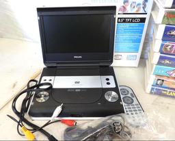 Phillips 8.5" Portable LCD DVD player with remote and 20+ Disney VHS movies.