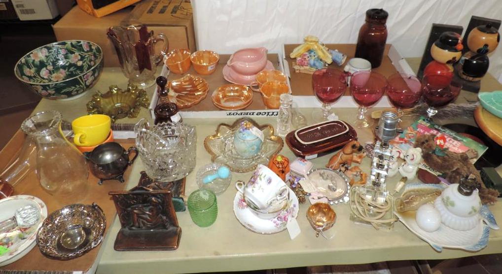 Tabletop full of antique glassware.