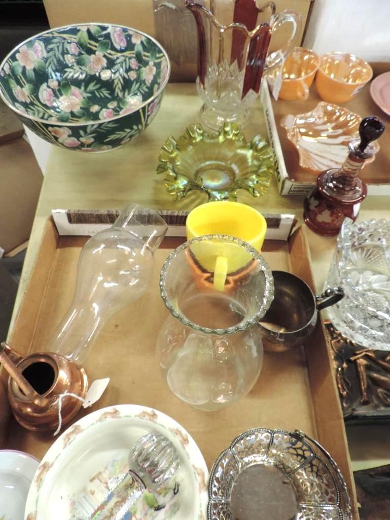 Tabletop full of antique glassware.