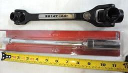 Craftsman dog bone wrench and spark plug socket.