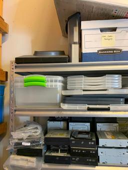 Contents of shelving back room-Cables, failed drives, cd drives, power supplies, computer parts,