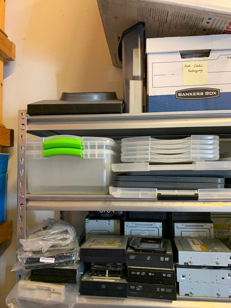 Contents of shelving back room-Cables, failed drives, cd drives, power supplies, computer parts,