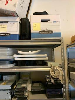Contents of shelving back room-Cables, failed drives, cd drives, power supplies, computer parts,