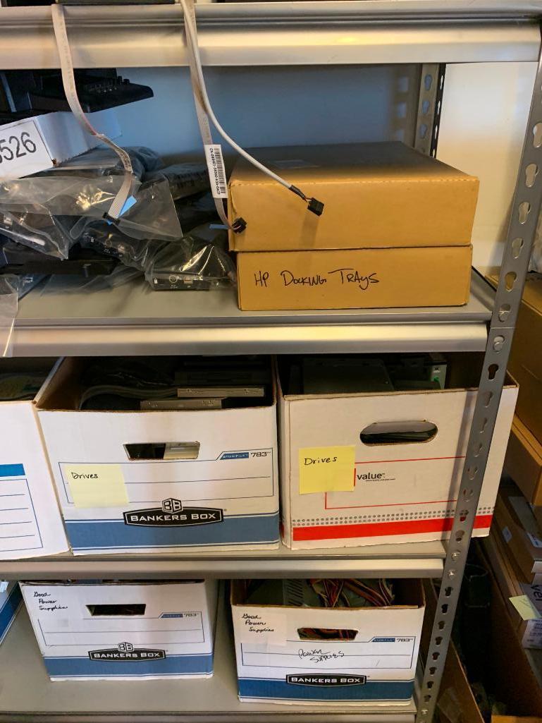 Contents of shelving back room-Cables, failed drives, cd drives, power supplies, computer parts,