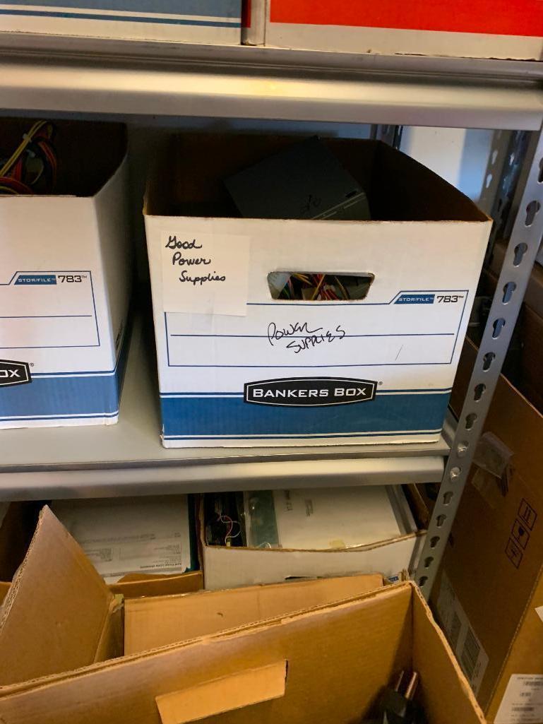 Contents of shelving back room-Cables, failed drives, cd drives, power supplies, computer parts,