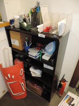Shelving unit loaded with office supplies.