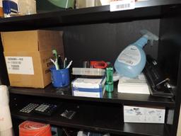 Shelving unit loaded with office supplies.