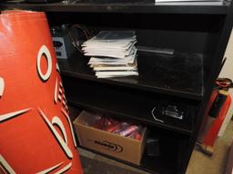 Shelving unit loaded with office supplies.