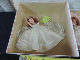 Two madam Alexander dolls.