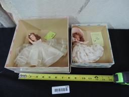 Two madam Alexander dolls.