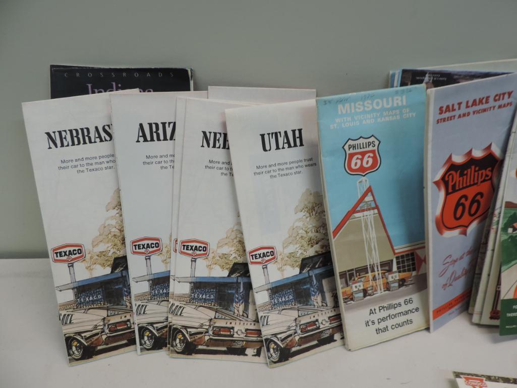 Over 120 vintage gas station road maps with Pepsi crate.