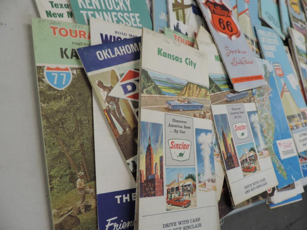 Over 120 vintage gas station road maps with Pepsi crate.