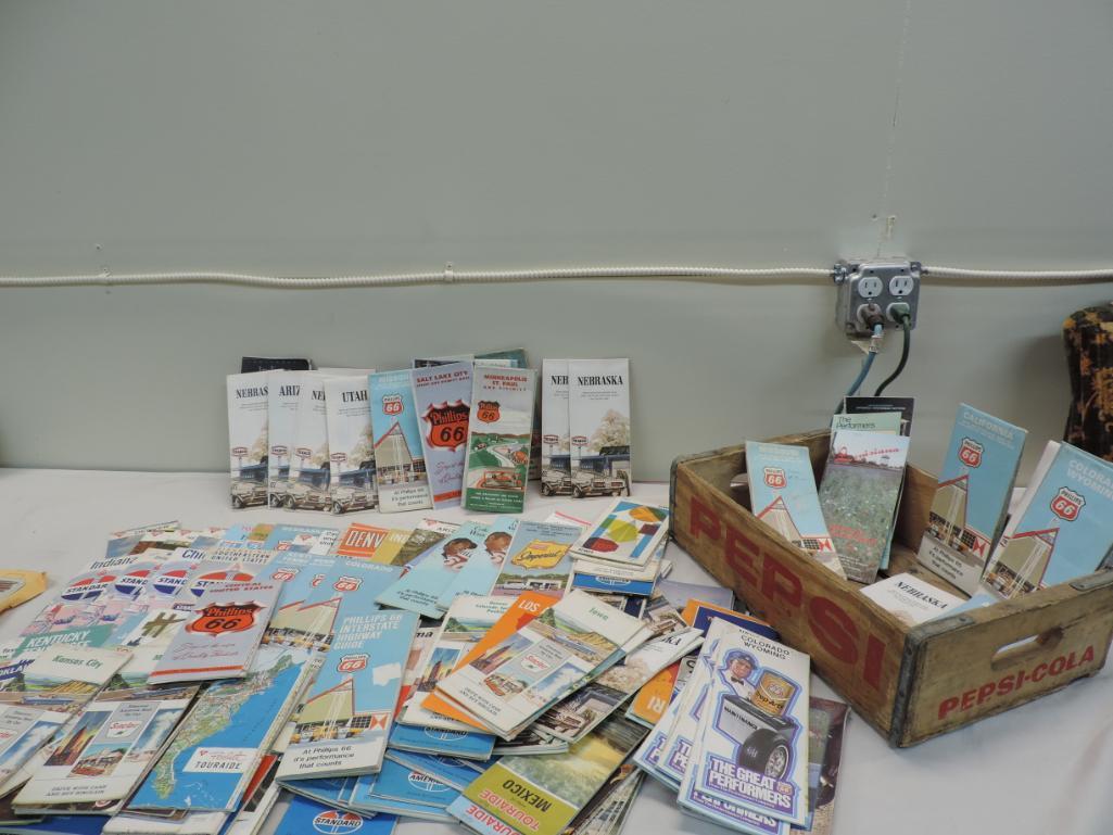 Over 120 vintage gas station road maps with Pepsi crate.